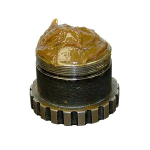 Cup of Almaplex Industrial Lubricant 1274 grease showing consistency and texture