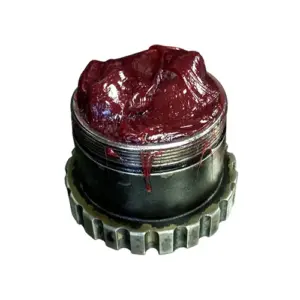 Cup of Almagard Vari-Purpose Lubricant 3752 grease showing consistency and texture