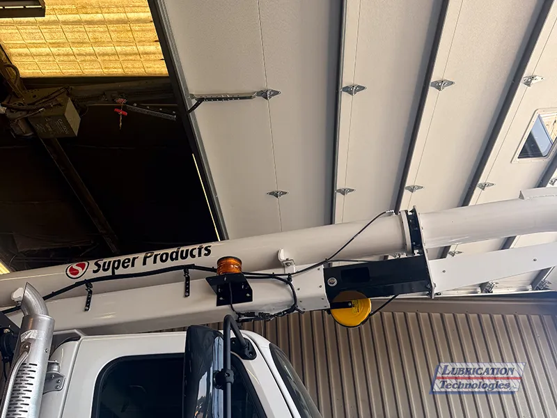 Super Products Camel 1200 boom arm with lubrication lines secured along the exterior.